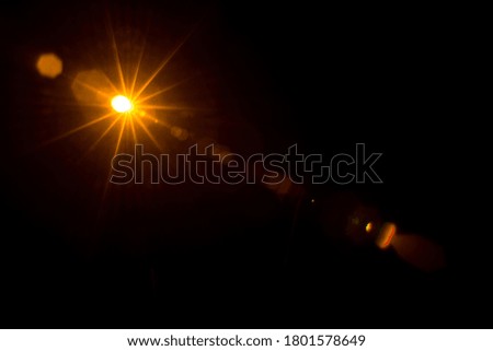 Abstract Natural Sun flare on the black.