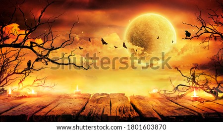 Halloween In Orange Art - Old Table With Candles And Branches At Scary Night With Full Moon
