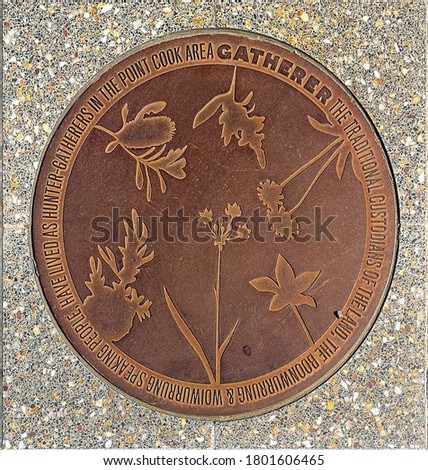 Symbolic manhole with natural and indigenous floral picture in Point Cook, Australia.