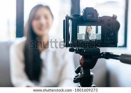 asian teenage talk to camera recording footage for social media clip Royalty-Free Stock Photo #1801609273