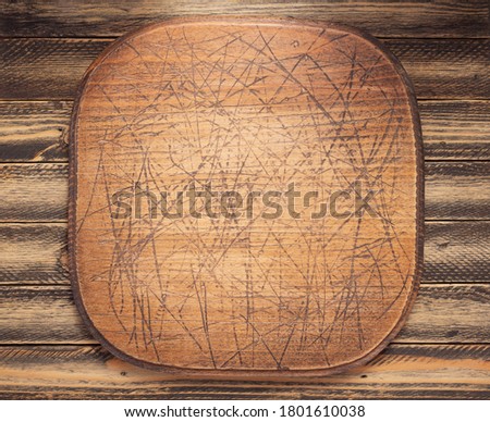 nameplate or wall sign board at wooden background texture surface with screws
