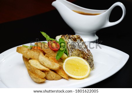 Pan-fried Cod Fish with potato wedges
