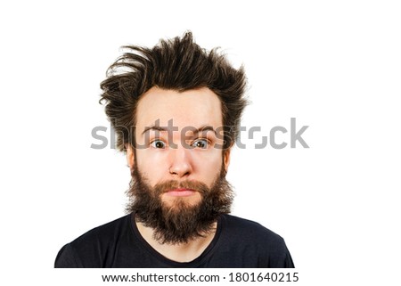 Shaggy young bearded guy with long hair before haircut on a white isolated background