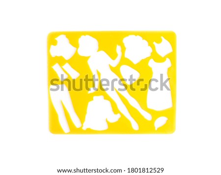 Yellow children's stencil on a white background with clothing figures, isolate