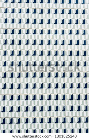 Vertical photo of the traditional retro tiles with geometric borders in Aveiro in Portugal