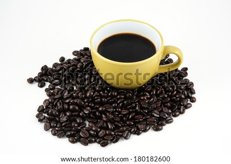 Coffee cup and beans on white-gray background