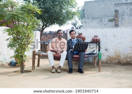 indian rural men meeting with financial advisor at village