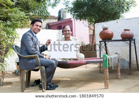 Salesman and farmer showing message