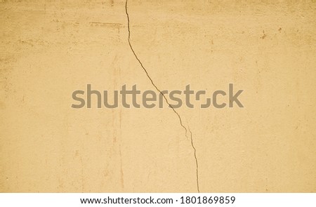 Orange color concrete wall surface, weathered with cracks and scratches, abstract texture for background