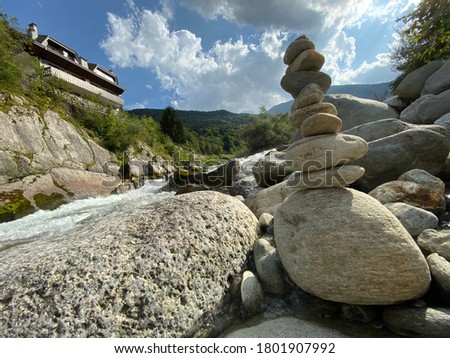 Close up on a pile of river stones on a quiet shore
