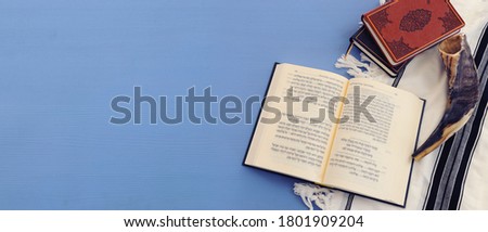 religion image of Prayer book and Shofar (horn) jewish religious symbols. Rosh hashanah (jewish New Year holiday), Shabbat and Yom kippur concept Royalty-Free Stock Photo #1801909204