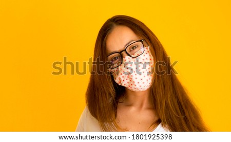 Caucasian young woman with face mask and glasses. Woman with 
surgical mask and glasses smiling Royalty-Free Stock Photo #1801925398