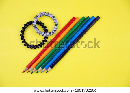 colored pencils and two hair bands
