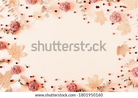 Autumn creative composition. eucalyptus, berries, leaves, roses, flowers on pastel pink background. Thanksgiving Day concept. Fall, autumn background. Flat lay, top view, copy space