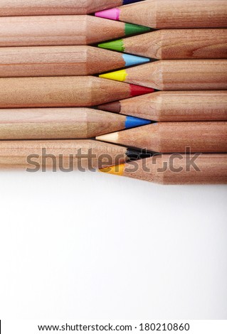 Colour pencils on white background closeup 