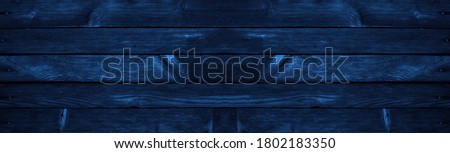 Blue grunge background. Wood texture background. Old painted wood wall. Dark blue background with copy space for design. Wide banner. Panoramic.