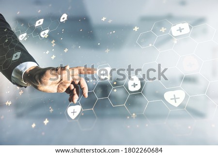 Man hand working with abstract virtual medical illustration on blurred office background. Medicine and healthcare concept. Multiexposure