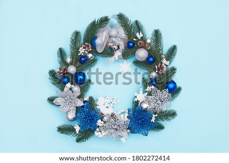 christmas wreath on a blue background, flatley, copyspace