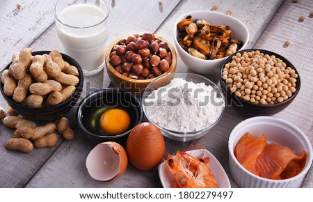 Composition with common food allergens including egg, milk, soya, peanuts, hazelnut, fish, seafood and wheat flour Royalty-Free Stock Photo #1802279497
