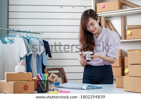 Startups Entrepreneurs Small Business SME. Female Freelance Asia Take product photos at home office. Online marketing.