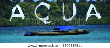 A boat at the the coast with a dense and lush green forest giving it a fantastic background. It is a perfect picture to be used as wallpaper