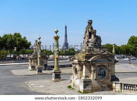 Statues de Lyon and Marseille on place de la Concorde in summer with the Eiffel Tower in the background - Paris, France.