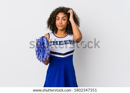 Young african american cheerleader woman isolated being shocked, she has remembered important meeting.