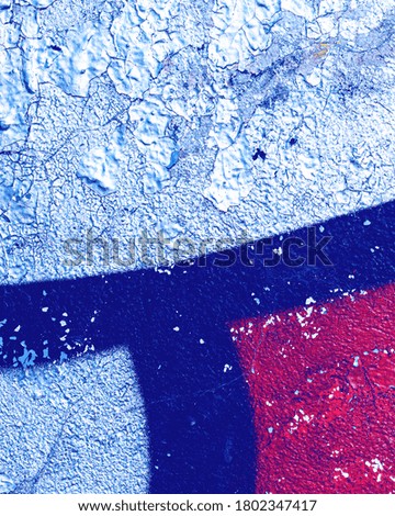 Fragment of colorful graffiti painted on a wall. Bright abstract background for design.