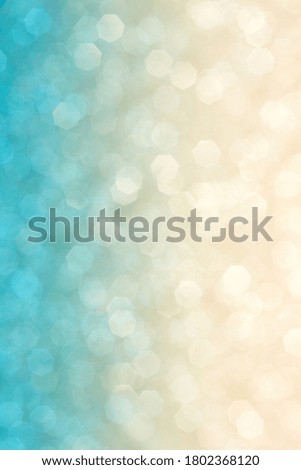 Current collection of brilliant backgrounds for your design. Close-up shot of blurred golden and blue sparkles in portrait format.