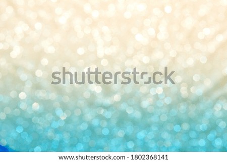 Current collection of brilliant backgrounds for your design. Close-up shot of blurred golden and blue sparkles in portrait format.