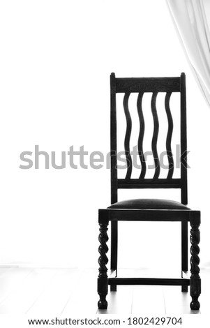 bright room of the antique oak chair.  
This expensive furniture is made in Britain. 

clear background with copy space.
Image for black  white photograph.