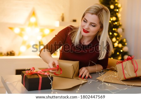 Portrait of a young woman during preparations for Christmas at home