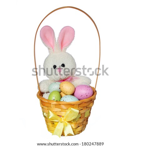 Easter basket with colorful eggs and bunny toy isolated on white