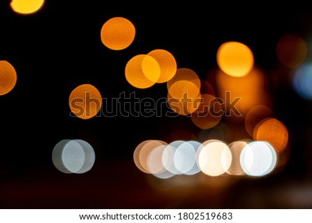 Blurred circle bokeh traffic on the road at night