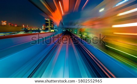 Abstract high speed technology POV train motion blurred concept from the Yuikamome monorail in Tokyo, Japan Royalty-Free Stock Photo #1802552965