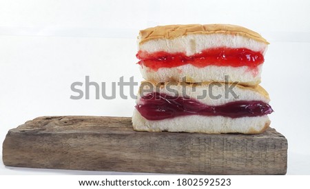 Junk food, jam-packed bread, fruit carts are wonderful at home. While COVID 19 was spreading With a picture of bread on a wooden shelf On a white background