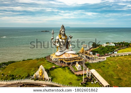 shiva statue isolated at murdeshwar temple aerial shots with arabian sea in the backdrop image is take at murdeshwar karnataka india. it is one of the tallest shiva statue in the world. Royalty-Free Stock Photo #1802601862