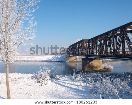 Plain Mantua, Italy - December 8, 2012: Pictures of Oglio river surrounded by snow