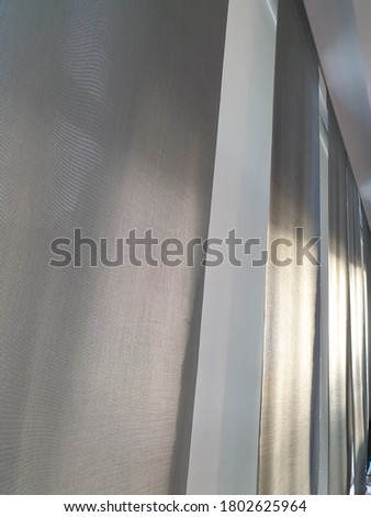 A curtain background to filter out the sunlight inside the building.  Abstract image of texture