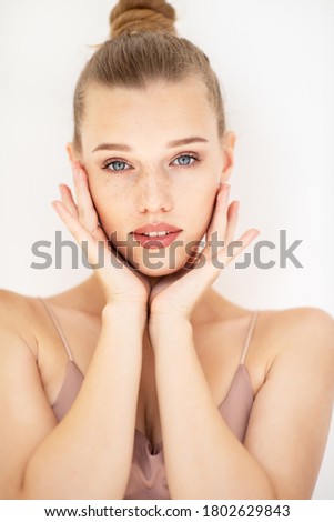 Portrait of beautiful woman with clean skin, youth concept, beauty treatment. Cheerful teen girl, beauty female face happy smiling and looking at camera over white background
