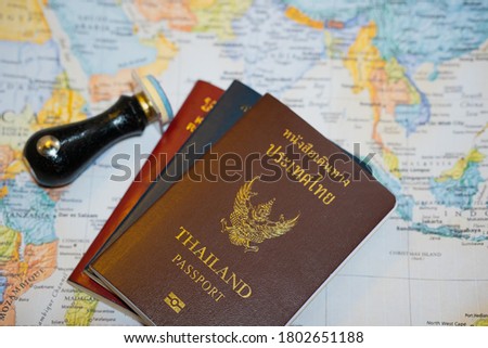 stock photo immigration control officer will arrival stamp in the passport