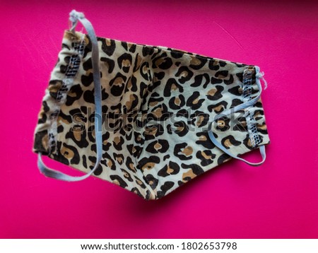 womens antibacterial mask on pink background, tiger style