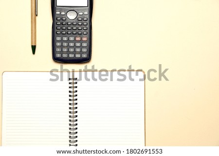 top view of workspace with calculator and pen with copy space. flat lay.flat design