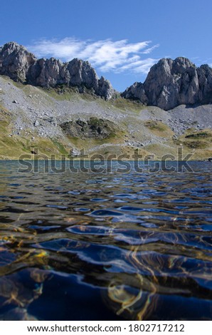 Lake in the middle of mountains, textures of water movement