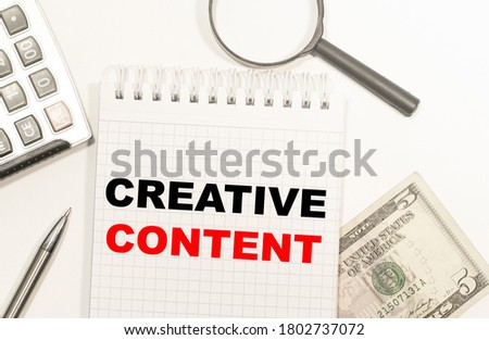 text BE CREATIVE CONTENT written on notepad with calculator, pensil, magnifier and dollars. Business concept