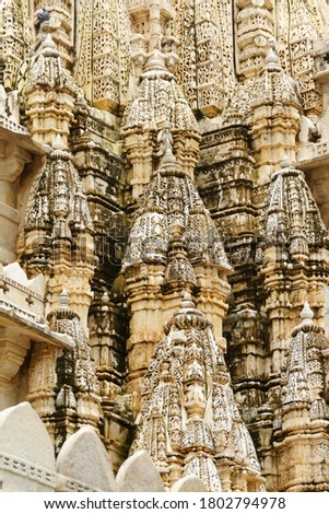 Stone carvings from the decorations of Chaumukha Jain Temple in Ranakpur, Rajastahn, India. Royalty-Free Stock Photo #1802794978