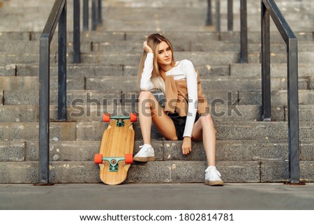 Beautiful woman skates around the city. Lifestyle and summer vacation. High quality photo
