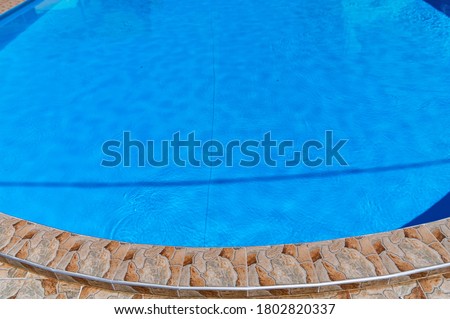 Modern outdoor luxurious swimming pool. Vacation concept