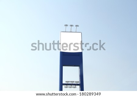 Blank billboard for advertisement and blue sky background.