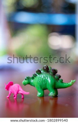 kids dinosaurs toys green and pink